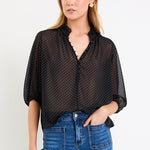 Woman wearing a black white polka dot top
col_pattern