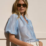 Model wearing a sheer pale blue blouse
col_pattern