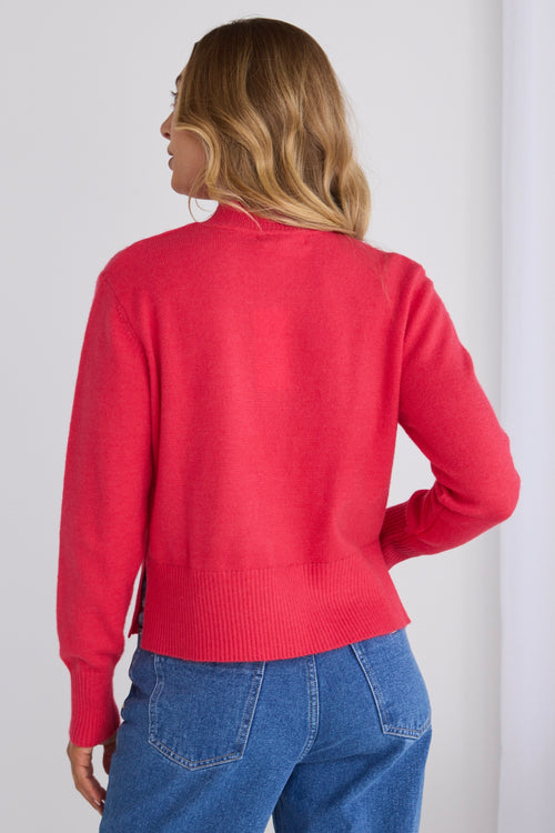 model wears a pink knit jumper