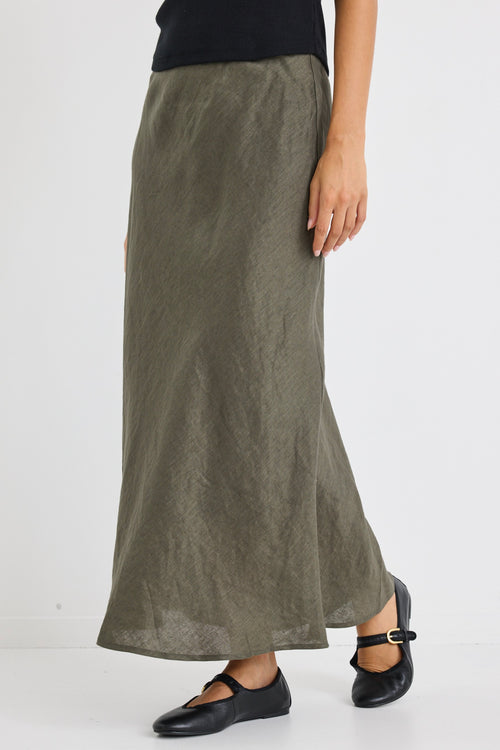 Model wears a khaki green linen midi skirt
