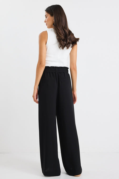 model wears a wide leg black pant