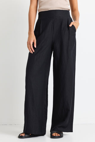 model wears black linen pants