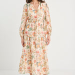 Woman wearing a floral dress on a white background