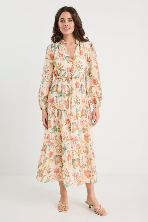 Woman wearing a floral dress on a white background
