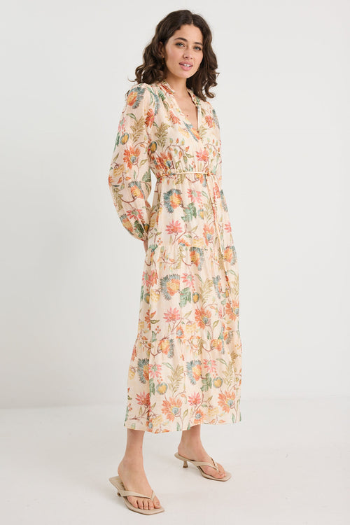 Woman wearing a floral dress on a white background