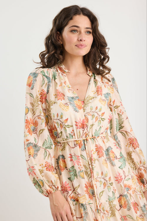 Woman wearing a floral dress on a white background