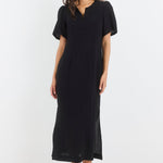 Woman wearing a black dress on a white background