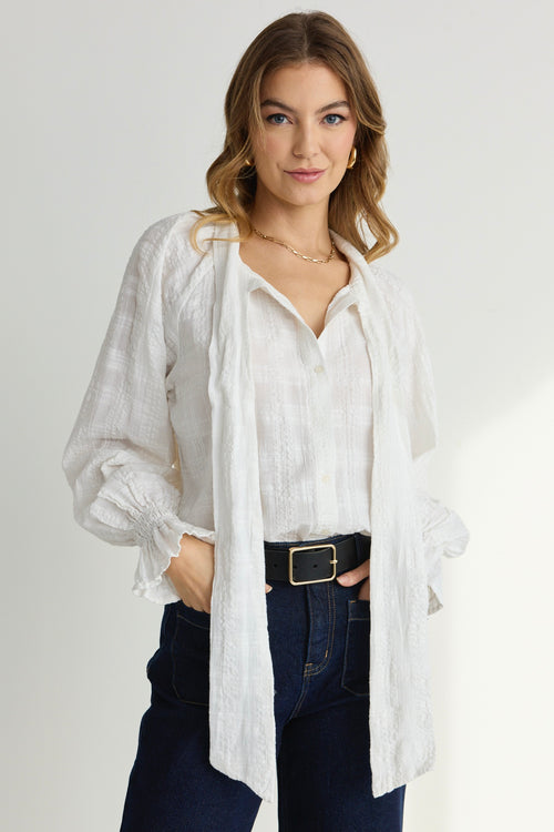 model wears a White Long Sleeve Blouse