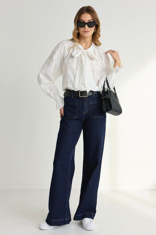 model wears a White Long Sleeve Blouse