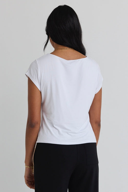 model wears a white tee