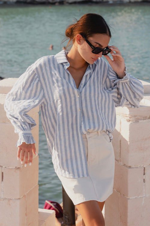 model wears a blue stripe shirt