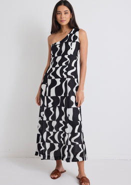 model wears a one shoulder black and white print dress