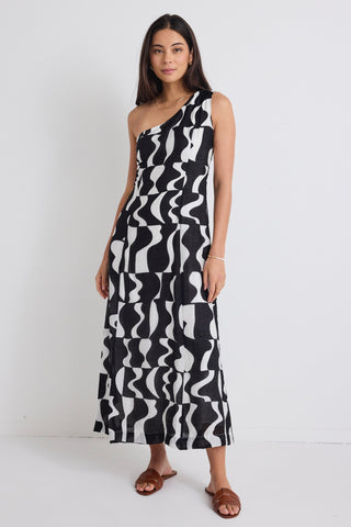 model wears a one shoulder black and white print dress