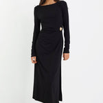 Woman wearing a black dress on a white background