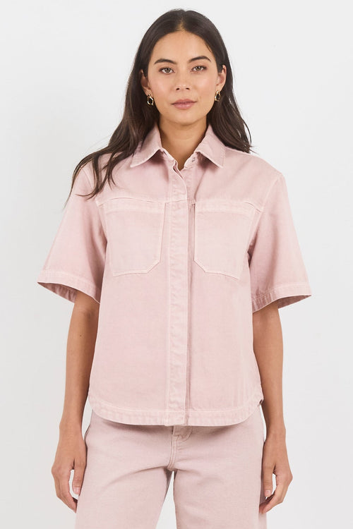 Woman wearing a pink outfit on a white background