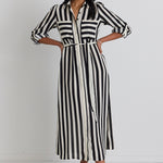 model wears a black and white stripe midi dress