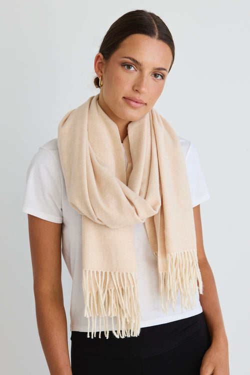 model wears a Cream Scarf