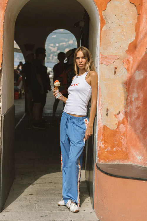 woman wearing a white tank top with a lobster print