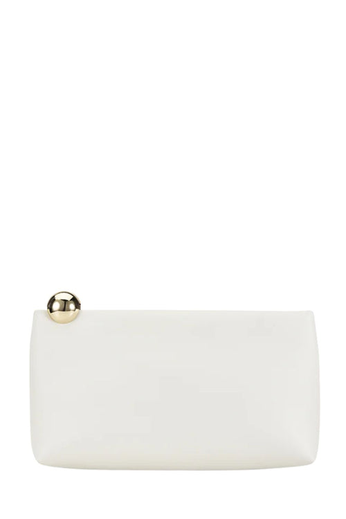 A minimalist white clutch bag with a small gold metallic button accent on the top left corner, set against a solid white background.