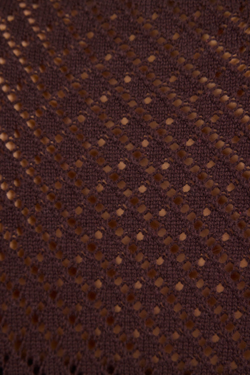 Close-up of brown fabric with a subtle pattern