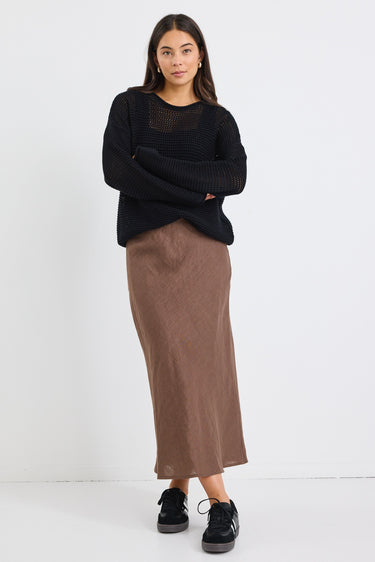 Model wears a brown linen midi skirt