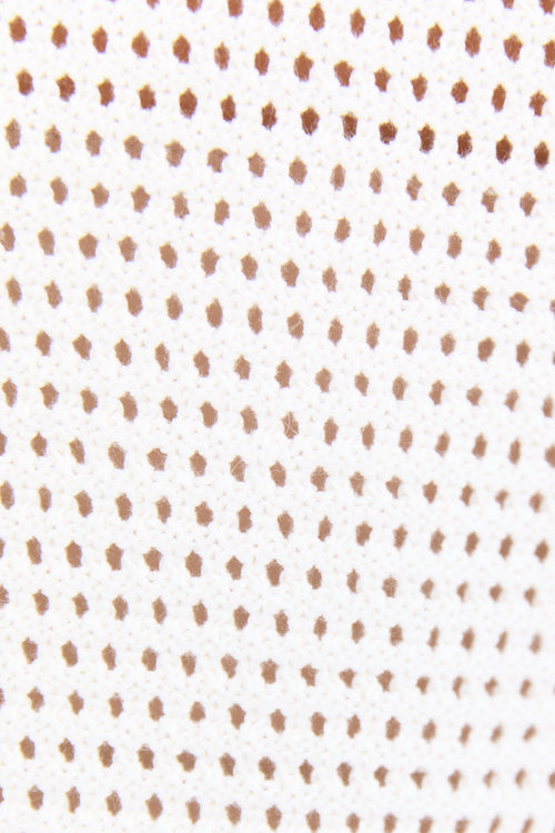 Pattern of small brown dots on a white background
