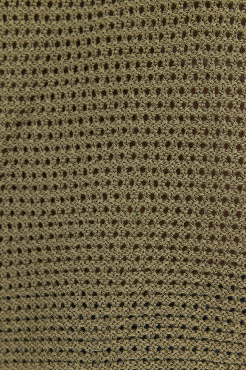 Close-up of a textured brown fabric with a subtle pattern