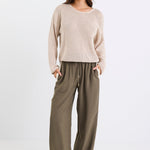 model wearing khaki pant with side stripe and drawstring waist