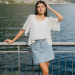 model wears a denim mini skirt