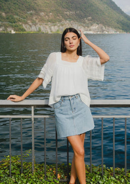 model wears a denim mini skirt