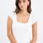 white rib fitted top with blue jeans