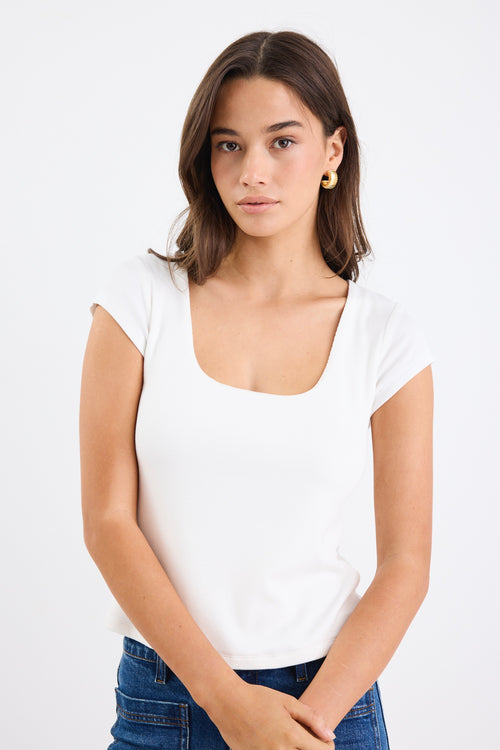 white rib fitted top with blue jeans