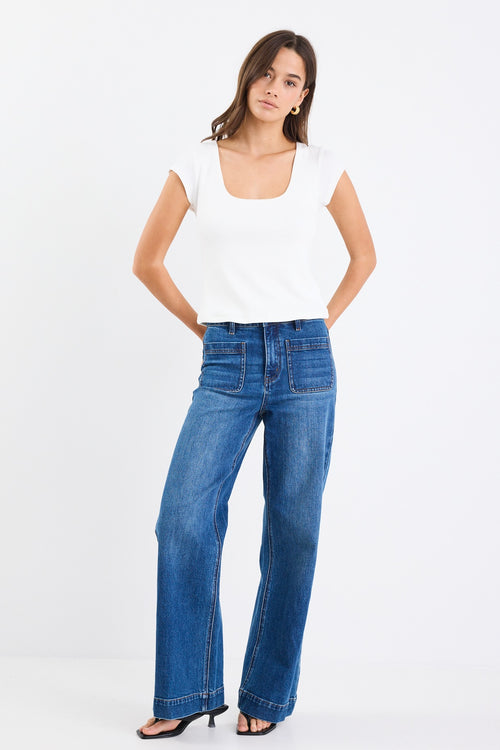 white rib fitted top with blue jeans