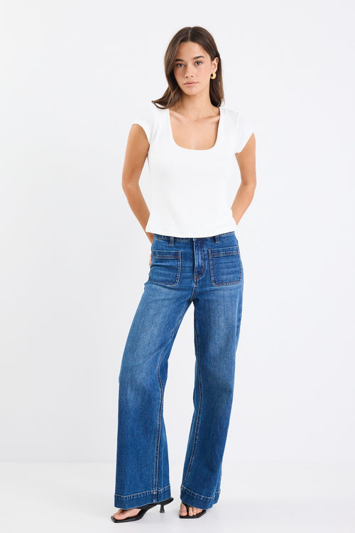 white rib fitted top with blue jeans