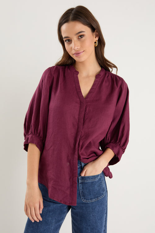 burgundy blouse on model 