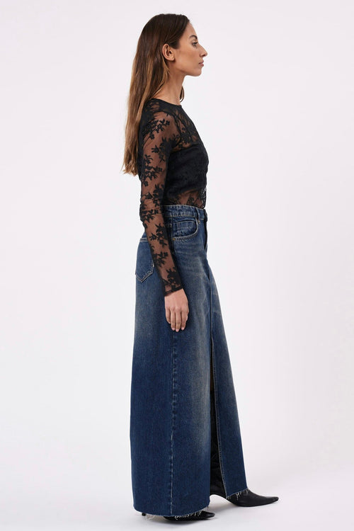 model wears a maxi denim skirt