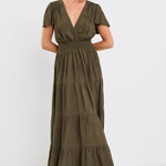 model wears a khaki maxi dress