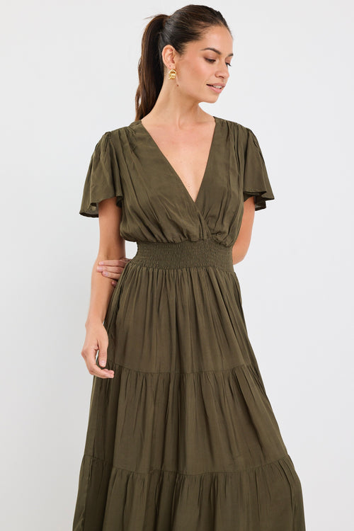 model wears a khaki maxi dress