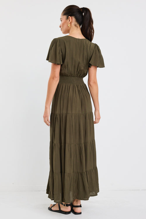 model wears a khaki maxi dress