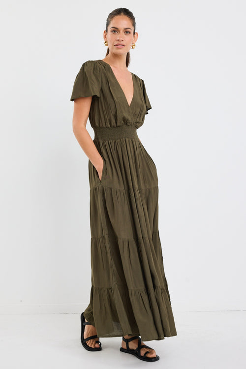 model wears a khaki maxi dress