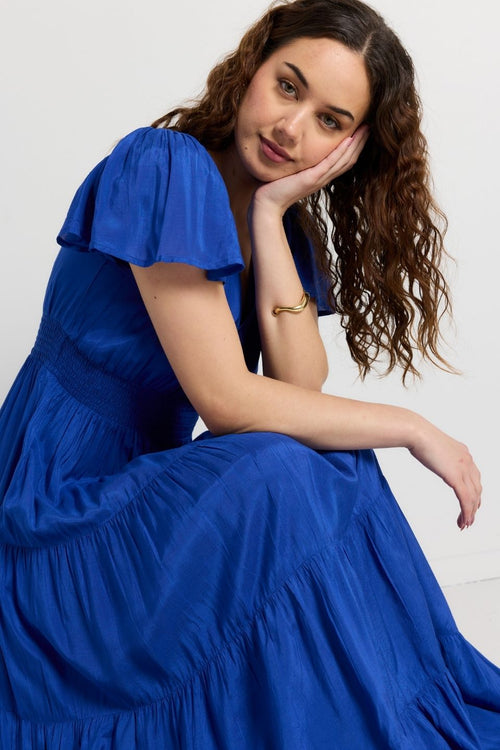 model wears Blue Shirred Maxi Dress