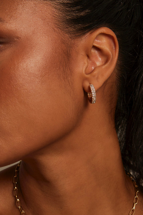 Model wears diamante hoop earring. 