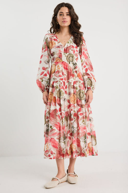 Woman wearing a floral dress on a white background