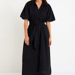 Woman wearing a black dress on a white background