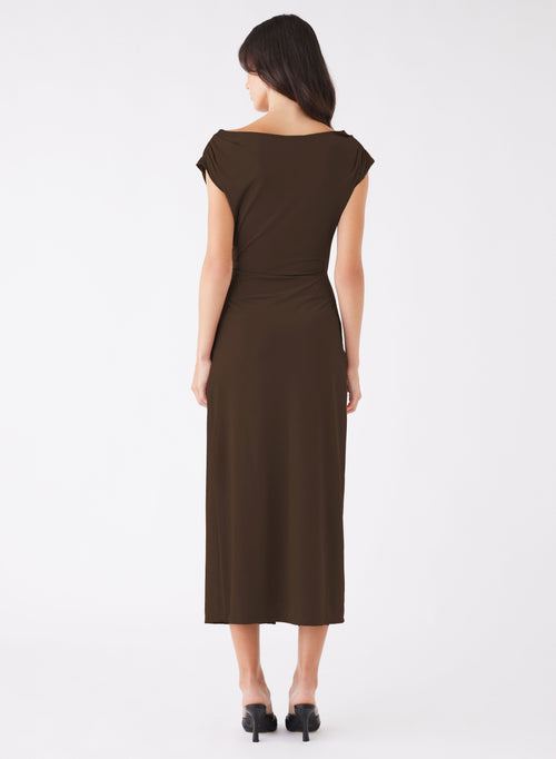 model wears a long brown dress