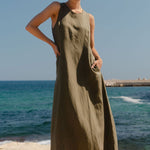 model wearing green linen dress