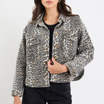 Woman wearing a leopard print jacket on a white background
