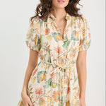 Woman wearing a floral dress on a white background