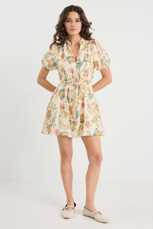 Woman wearing a floral dress on a white background
