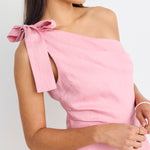 model wears a one shoulder pink mini dress